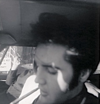 Mid-late September, 1968. This looks to be at Graceland and judging by the length of his hair in the back, roughly around the same time as the pool and go kart photos. There are other photos that I place in this period in which his hair is longer in the back (late August/early September '68 of Elvis signing autographs from his car, him w/ Lisa, Priscilla and Dodger when he is wearing black with a red scarf).